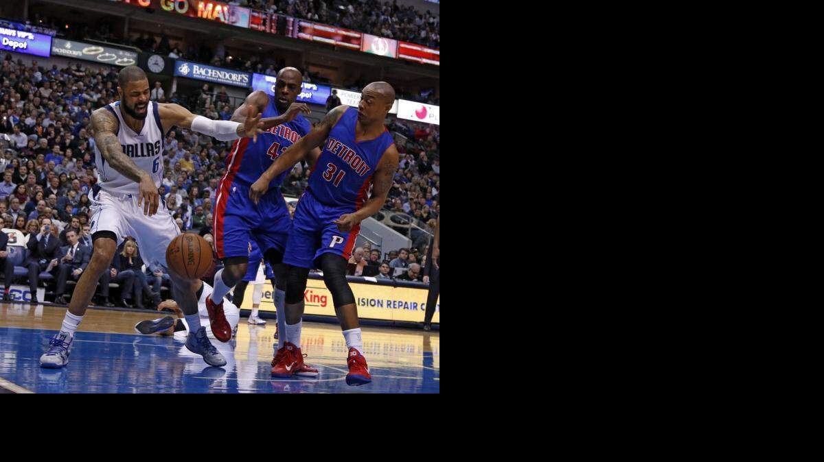 
 Mavericks center Tyson Chandler, left, fights for a rebound against Detroit. Chandler has 17 double-doubles this season, surpassing his total for last season. 
