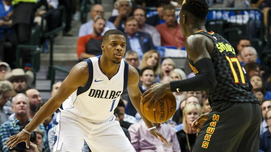 The Dallas Mavericks’ Dennis Smith Jr. (1) defends against the Atlanta Hawks’ Dennis Schroder (17) in Wednesday’s season opener. Smith did not play Friday because of swelling in his left knee.