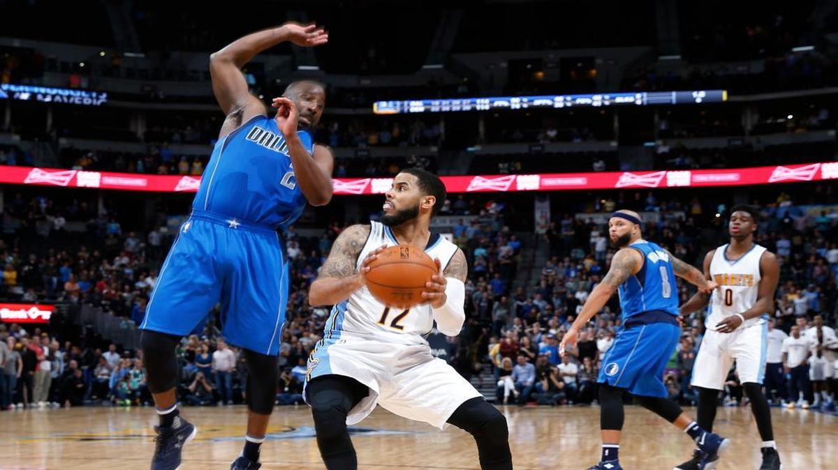 Dallas Mavericks guard Raymond Felton fouls Denver Nuggets guard D.J. Augustin with 0.9 seconds left in overtime.