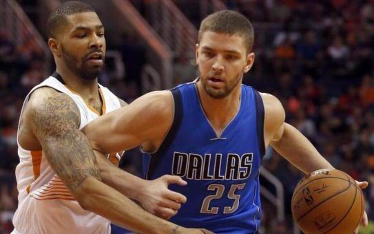 
Chandler Parsons, right, led the Mavericks with 19 points Sunday, but said Marcus Morris and the Suns “were more hungry than us tonight.”


