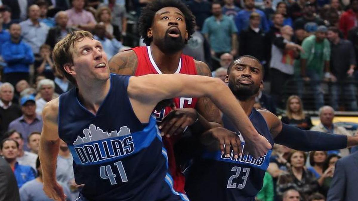 Mavericks forward Dirk Nowitzki (41) and guard Wesley Matthews (23) block out Clippers center DeAndre Jordan (6) in the fourth period. The Mavericks beat the Clippers 118-108 in Dallas.