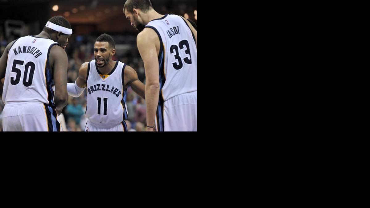 
Memphis Grizzlies point guard Mike Conley, center, discusses strategy with big men Zach Randolph and Marc Gasol. The Grizzlies, tied for the NBA’s second-best record, host the Mavericks on Tuesday.


