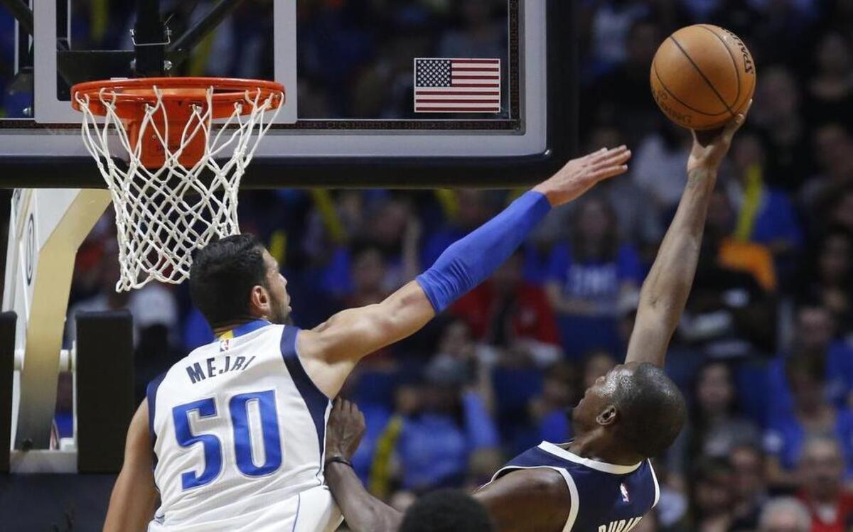 
Mavericks coach Rick Carlisle said that center Salah Mejri, left, is an intriguing player.

