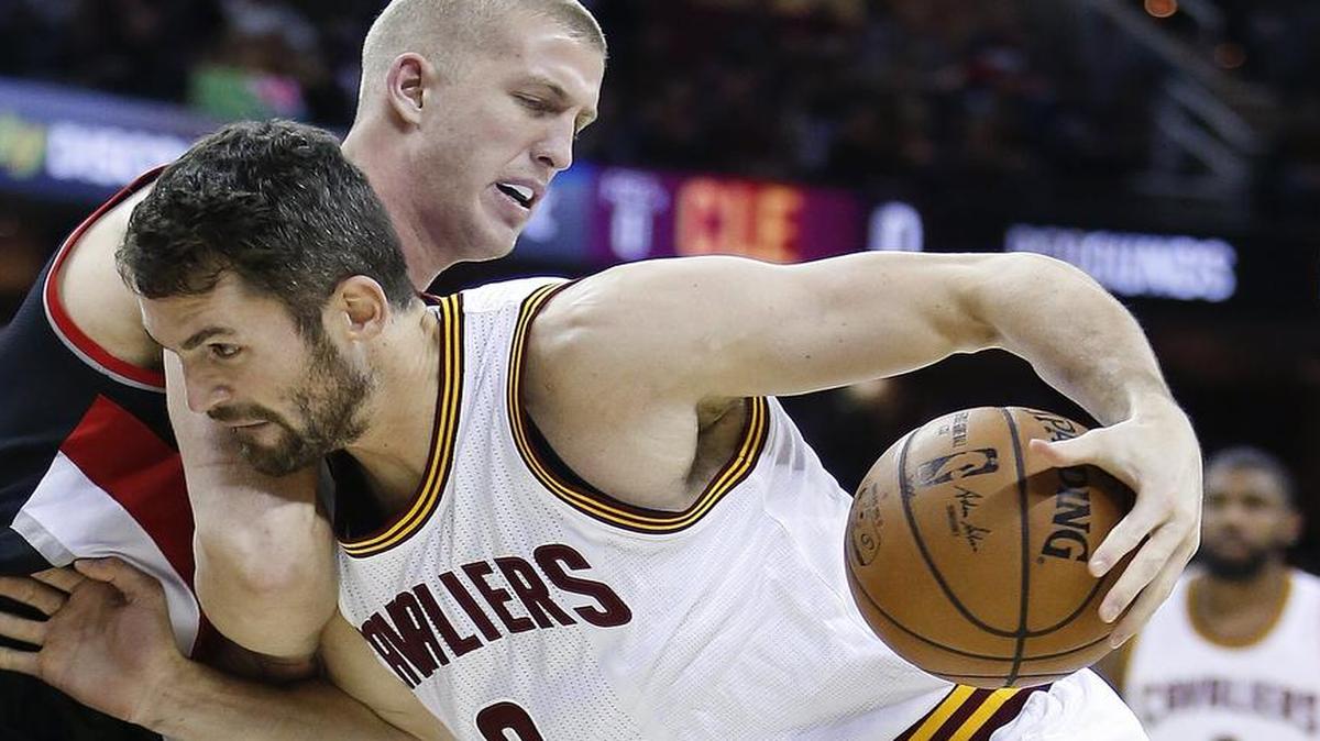 The Cleveland Cavaliers’ Kevin Love (0), driving against Portland Trail Blazers’ Mason Plumlee, scored an NBA-record 34 points in the first quarter Wednesday night. He finished with 40 points. Love fell three points shy of the league record for points in any quarter, set by Golden State’s Klay Thompson, who scored 37 in the third on Jan. 23, 2015. The Cavaliers host the Dallas Mavericks at 6:30 p.m. Friday on FSSW.