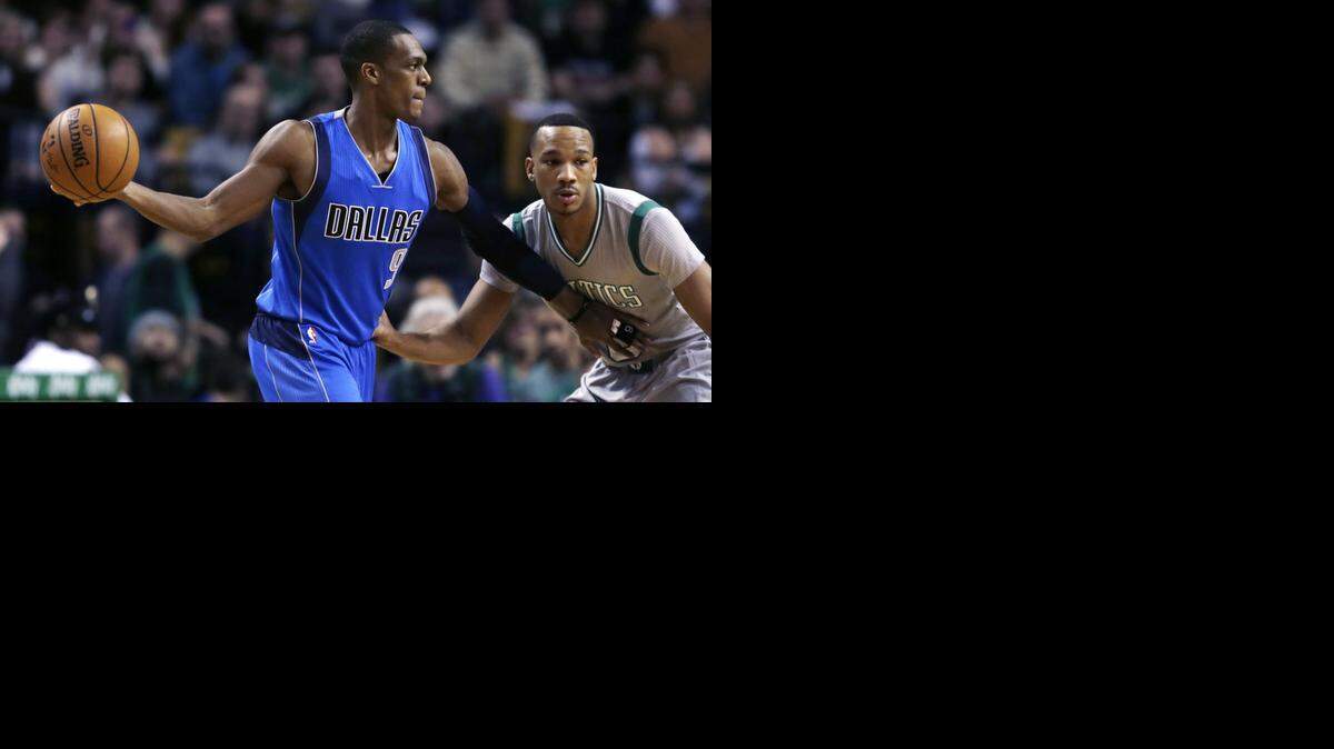 
Mavericks point guard Rajon Rondo, left, has only scored 14 points in the last four games, but he also has 23 rebounds and 38 assists.


