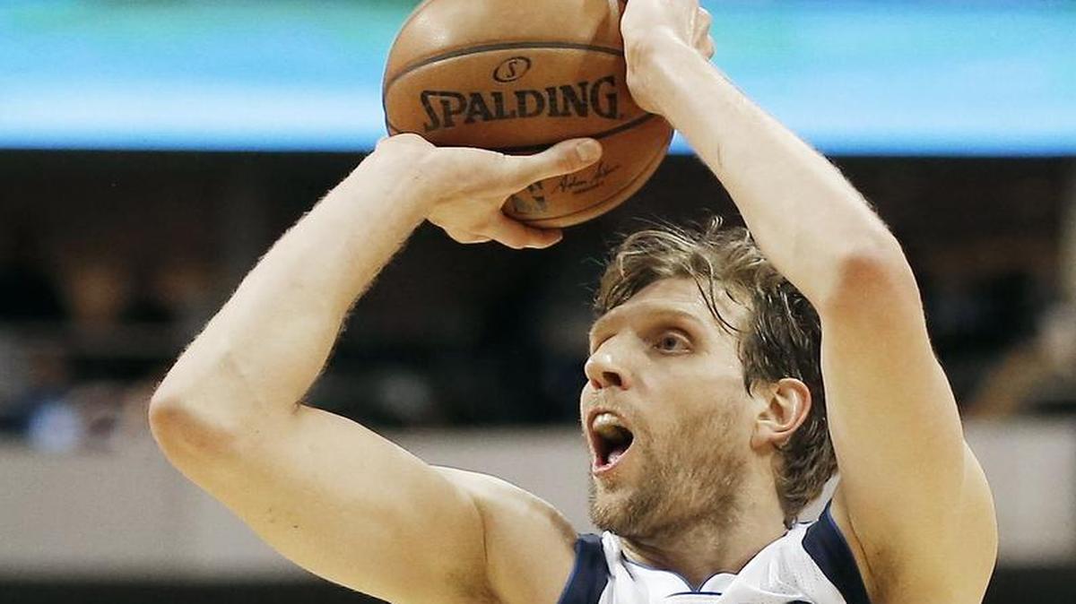 Dallas Mavericks forward Dirk Nowitzki (41) attempts a shot during overtime of an NBA basketball game against the Portland Trail Blazers Sunday, March 20, 2016, in Dallas. Dallas won in overtime 132-120.