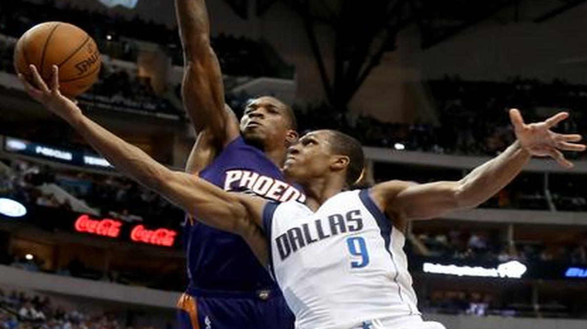 
Dallas Mavericks guard Rajon Rondo (9) drives around Phoenix Suns Eric Bledsoe during the second half of an NBA basketball game in Dallas on Wednesday, April 8, 2015. Dallas won 107-104. 
