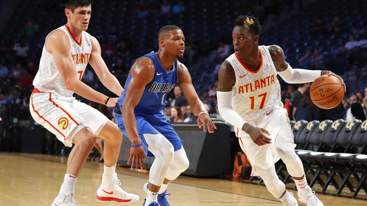 Mavericks rookie guard Dennis Smith Jr., middle, left Thursday’s game with an injured ankle after he was tangled up with Atlanta Hawks guard Dennis Schroder (17).