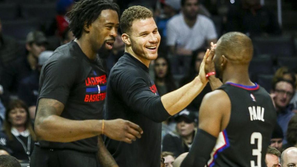 DeAndre Jordan (left), pictured with his former L.A. Clippers teammates, should make the Dallas Mavericks a threat to win 40 games now that he has committed to sign with them as a free agent.
