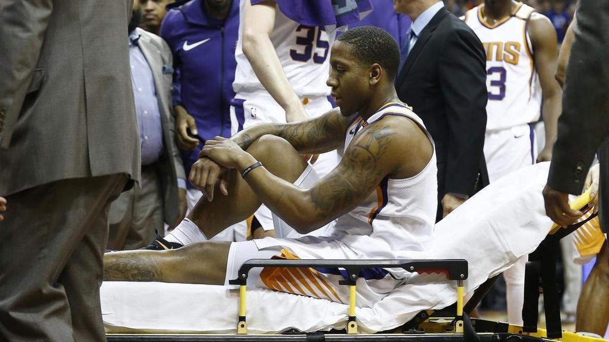Phoenix Suns guard Isaiah Canaan is taken off the court after breaking his left ankle in the first quarter against the Dallas Mavericks Wednesday night. The Suns beat the Mavericks 102-88.
