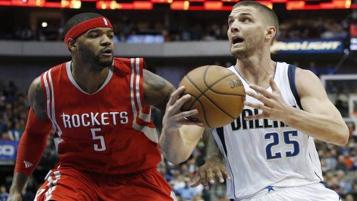 
Mavericks forward Chandler Parsons injured his left ankle Feb. 20 against Josh Smith and the Rockets.



