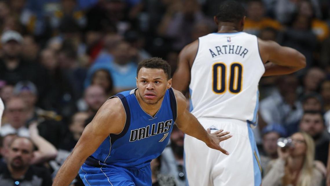 Rookie Justin Anderson, left, scored 11 points with four rebounds and two blocked shots to help the Mavericks take down Darrell Arthur and the Nuggets.