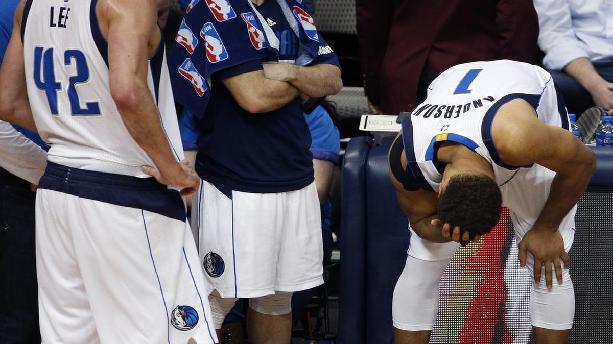 Dallas Mavericks guard Justin Anderson (1) holds his head after being fouled in the fourth quarter by Oklahoma City Thunder forward Kevin Durant (35.