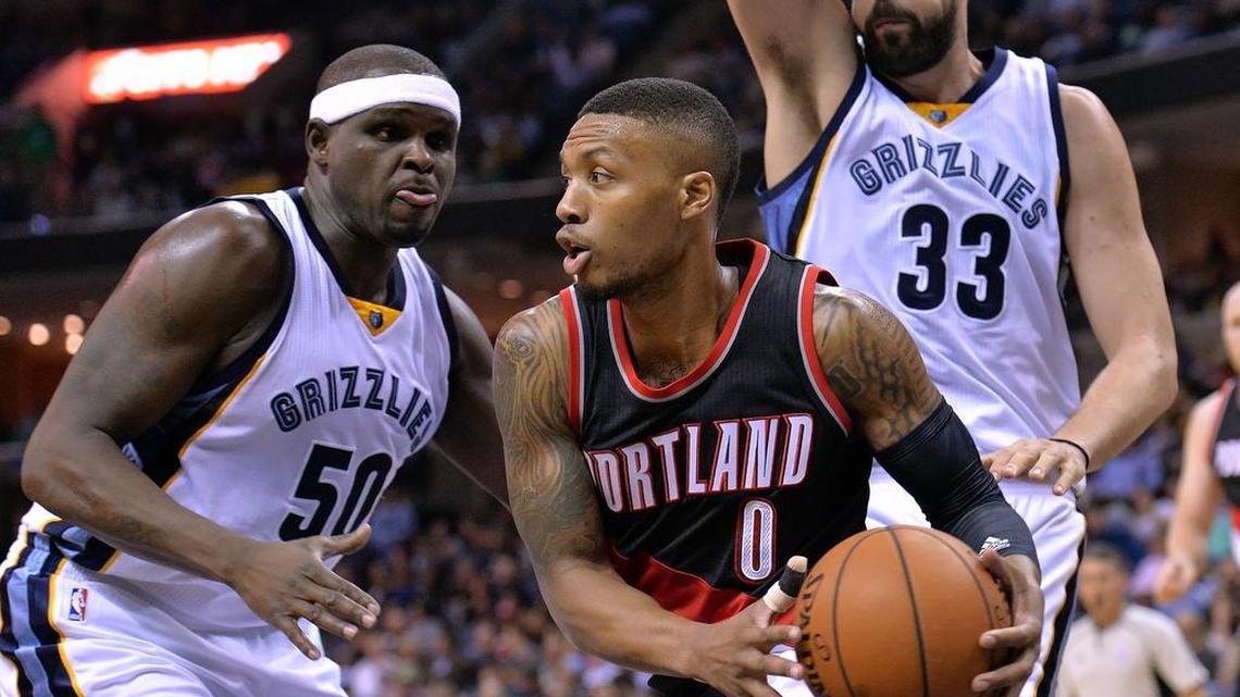 Blazers points guard Damian Lillard, center, is averaging 25.4 points and 72. assists per game entering Tuesday’s game against the Mavericks.