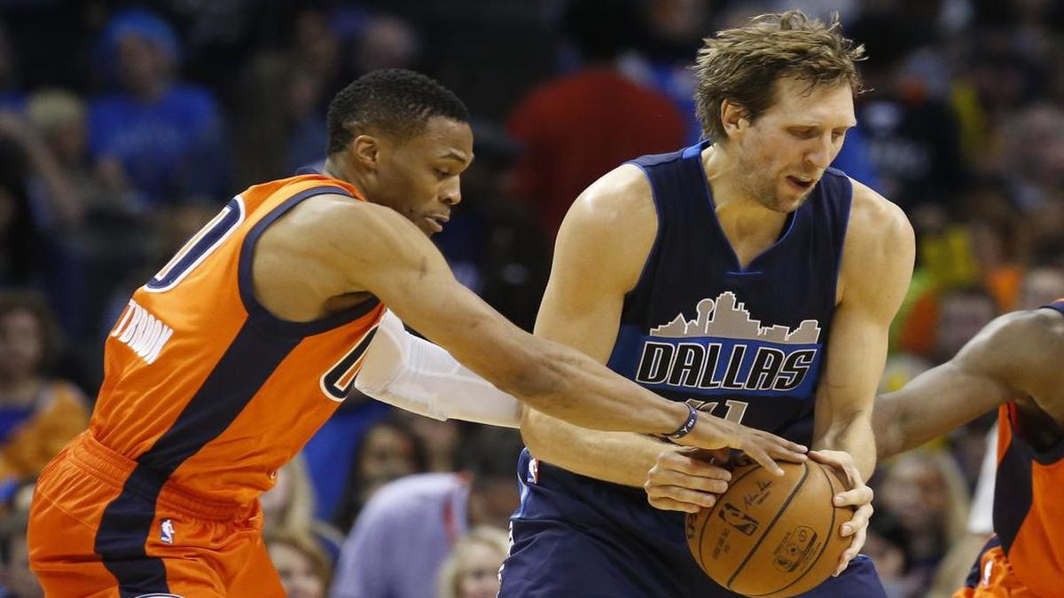 Point guard Russell Westbrook, left, trying to poke the ball from Dirk Nowitzki on Nov. 22, leads the Thunder into Wednesday’s game against the Mavericks. The game will be televised at 7:30 p.m. on FSSW.