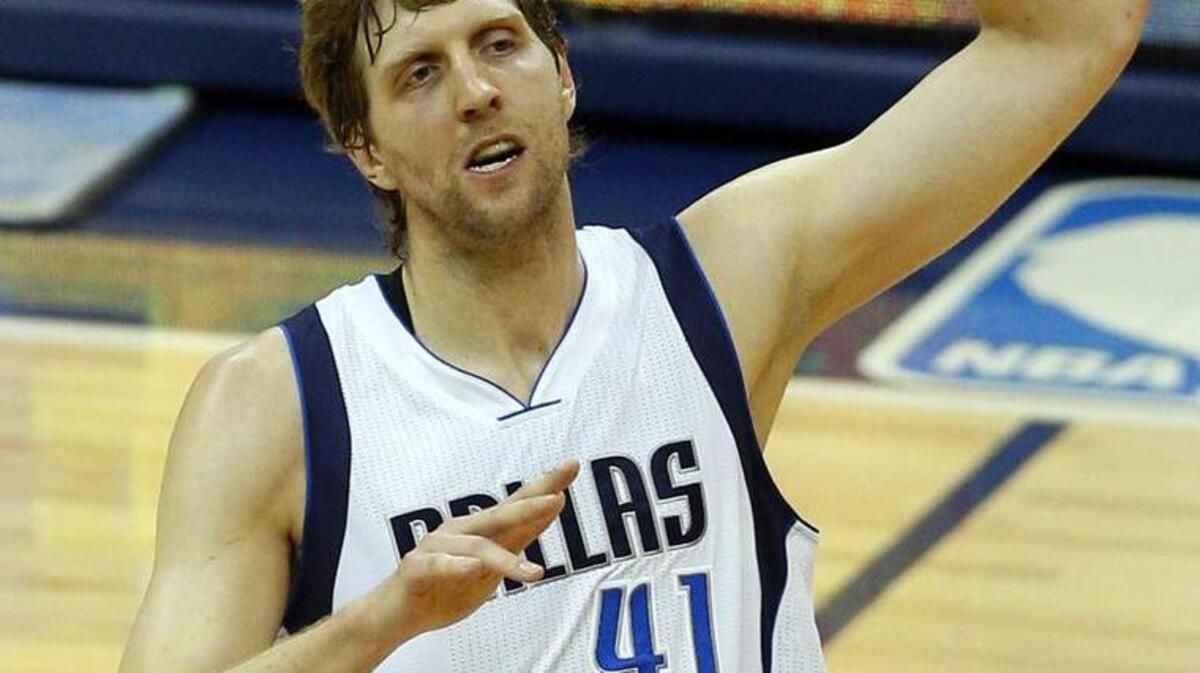 
Mavs forward Dirk Nowitzki (41) celebrates after he drilled a 3-point basket.
