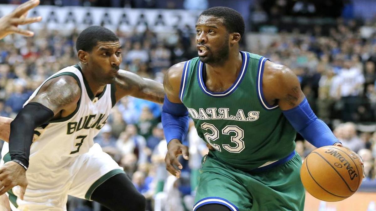 Dallas Mavericks guard Wesley Matthews (23) battles Milwaukee Bucks guard O.J. Mayo (3) for space during the second half of an NBA basketball game Monday, Dec. 28, 2015, in Dallas. Dallas won 103-93. (AP Photo/Brandon Wade)