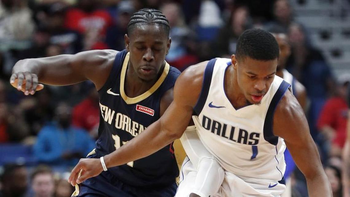 Dallas Mavericks guard Dennis Smith Jr. (1) steals the ball from New Orleans Pelicans guard Jrue Holiday (11) in the first half of an NBA basketball game in New Orleans, Friday, Dec. 29, 2017.