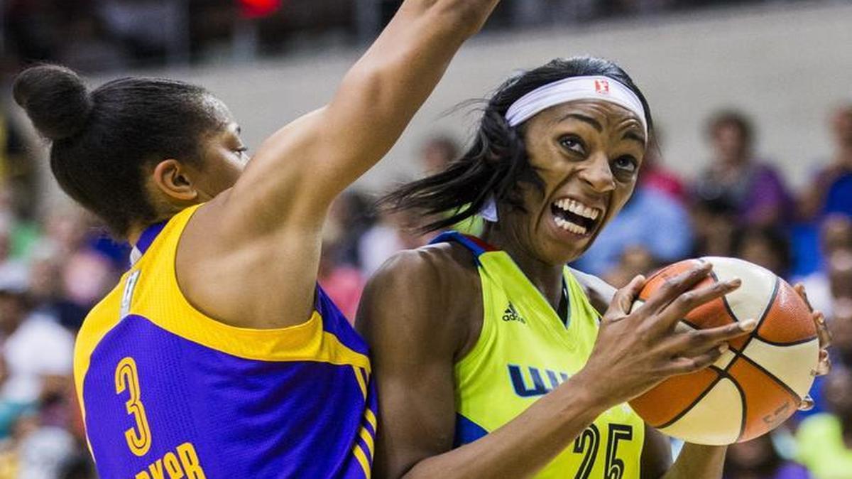 Wings forward Glory Johnson, right, finished with seven points and six rebounds in Saturday’s loss to the LA Sparks and Candace Parker.