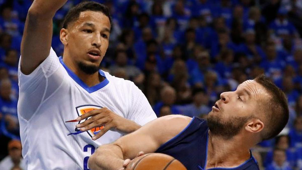 Mavericks guard J.J. Barea, right, trying to see over Thunder guard Andre Roberston, will miss Monday’s game after aggravating a groin strain.