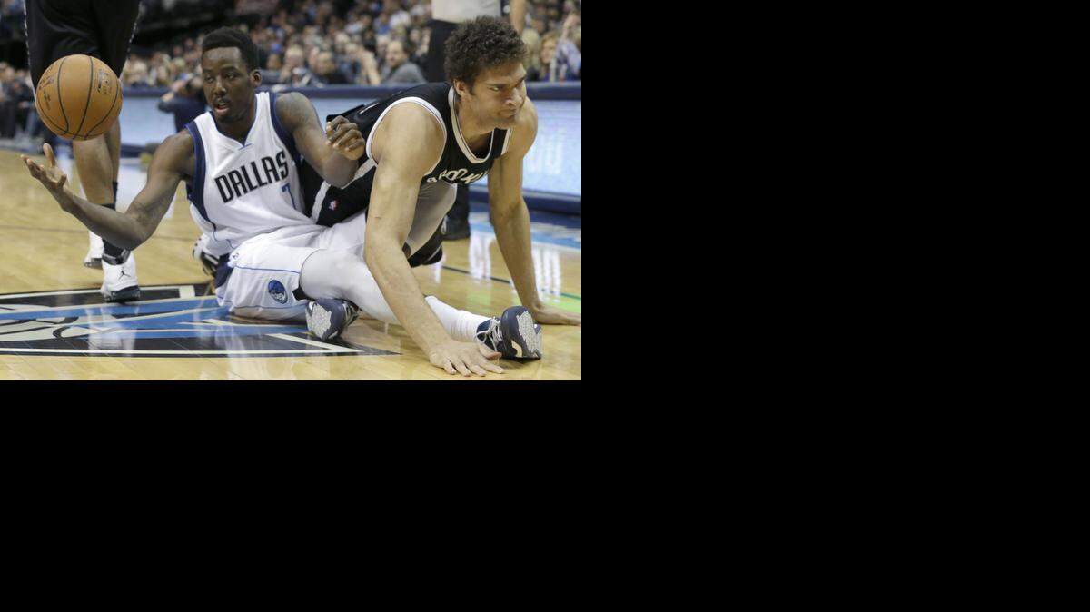 
Al-Farouq Aminu, left, and the Mavs have been caught flat at home against below-.500 teams like the Nets.


