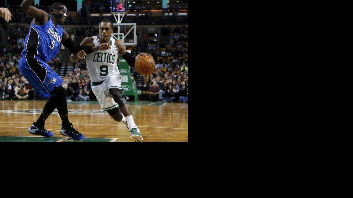 
Boston Celtics guard Rajon Rondo, right,  drives against Orlando Magic guard Victor Oladipo  in a game Wednesday. 
