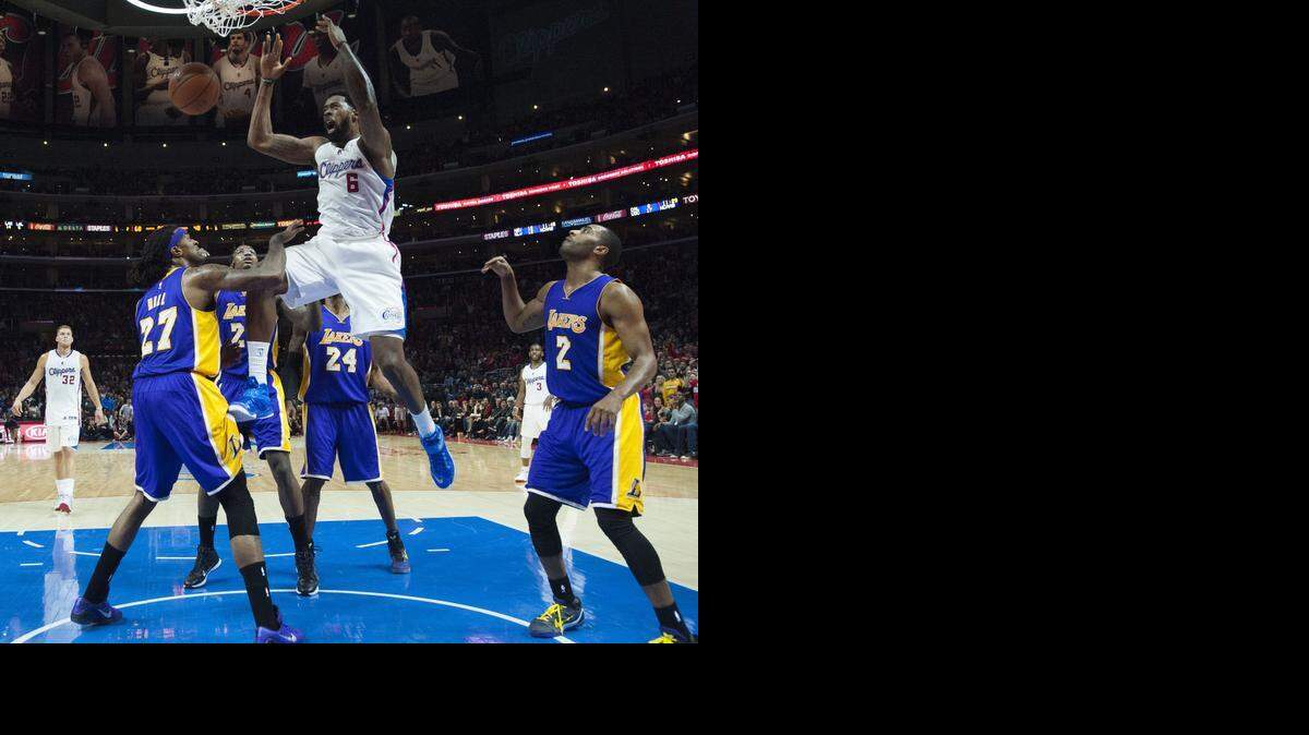 
Clippers center DeAndre Jordan, dunking Wednesday against the Lakers, leads the NBA in rebounds (13.6 points per game) and dunks (106 total).


