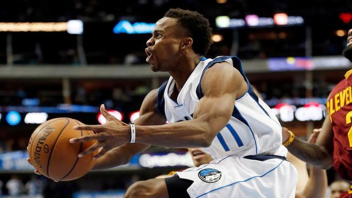 Dallas Mavericks guard Yogi Ferrell (11) jumps past Cleveland Cavaliers guard Kyrie Irving (2) and forward Richard Jefferson (24) during the second half of an NBA basketball game, Monday, Jan. 30, 2017, in Dallas. Dallas won 104-97.