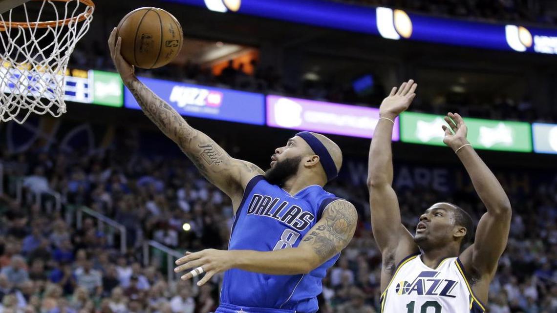 Point guard Deron Williams, left, scored 23 points and had six assists to help the Mavericks sink Alec Burks and the Jazz.