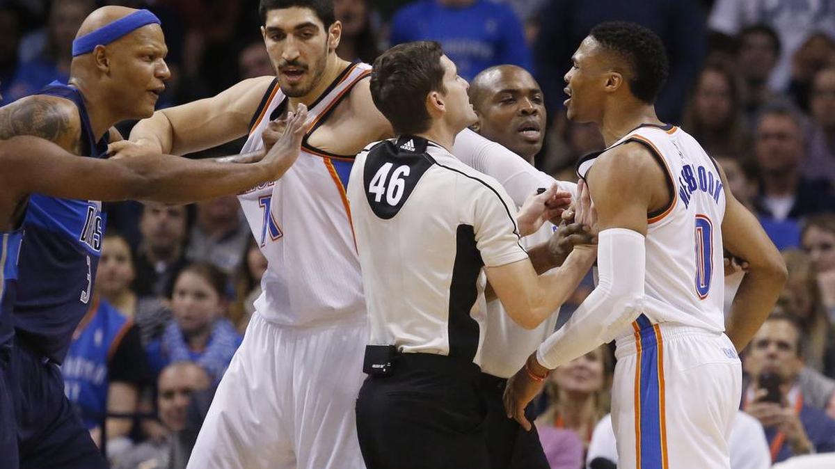 Officials Ben Taylor (46) and Courtney Kirkland, second from right, step between Mavericks forward Charlie Villanueva, left, and Oklahoma City Thunder guard Russell Westbrook (0) during an altercation in the first half in Oklahoma City on Wednesday night. Villanueva was ejected on the play and Westbrook was ejected minutes later after picking up his second technical foul.