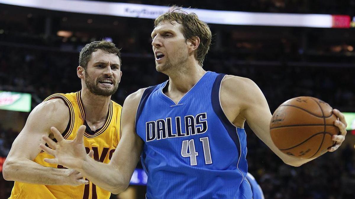 Dallas Mavericks forward Dirk Nowitzki (41) looks to pass against Cleveland Cavaliers’ Kevin Love (0) during the second half of an NBA basketball game Friday, Nov. 25, 2016, in Cleveland. The Cavaliers won 128-90. Nowitzki hasn’t played since the game against the Cavaliers. He was set to return Friday night.