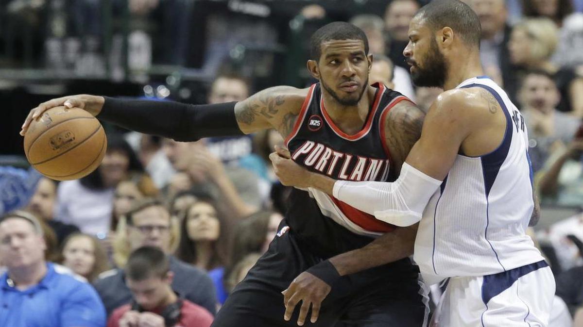 
Portland Trail Blazers forward LaMarcus Aldridge, left, is defended by Dallas Mavericks center Tyson Chandler during a game last season. Chandler and Aldridge are both expected to be highly coveted free agents this summer. 
