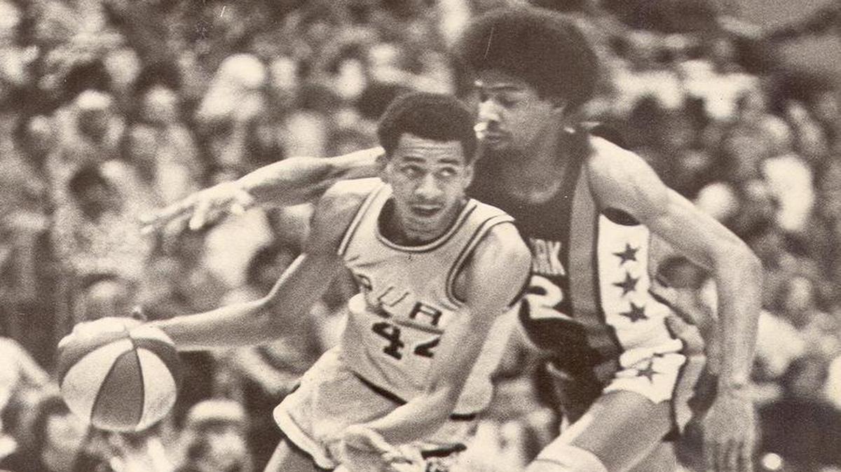 In a clash of mega-stars, San Antonio’s George “The Iceman” Gervin drives around Julius “Dr. J” Erving of the New Jersey Nets in a 1975 game at the old HemisFair Arena in San Antonio.
