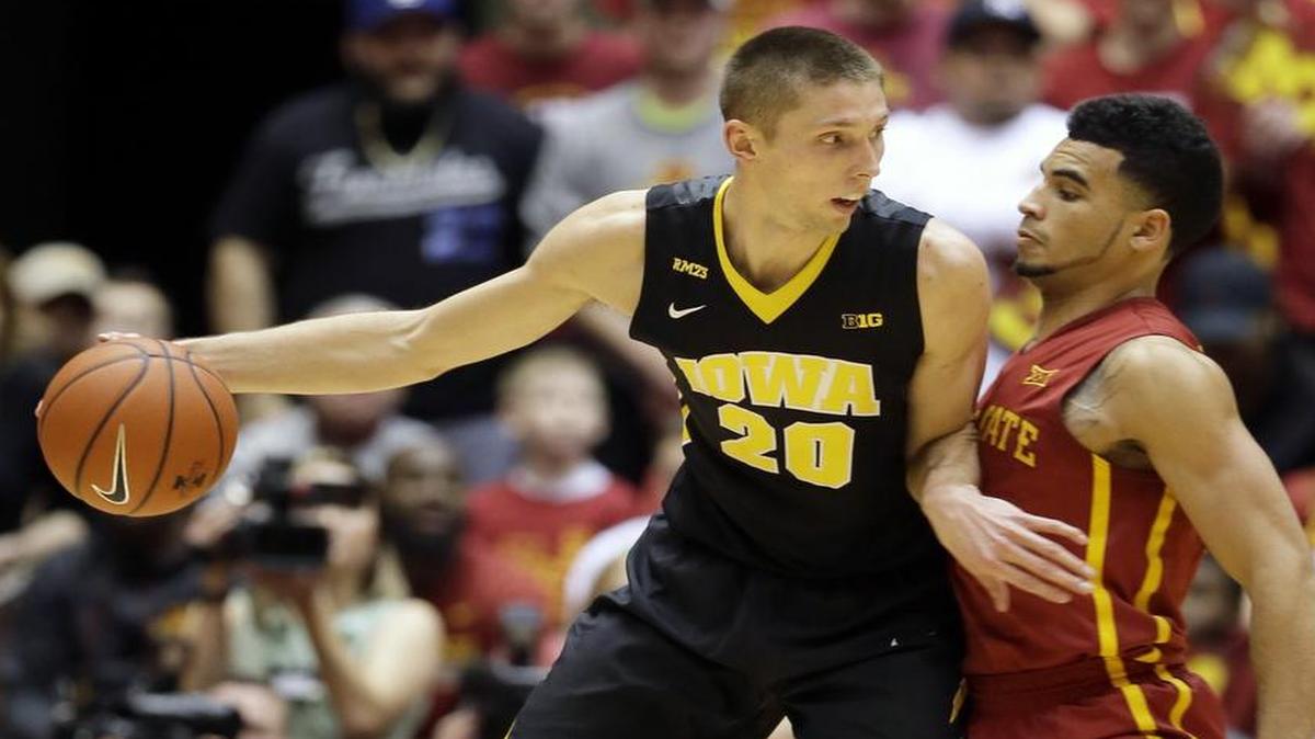 Former Iowa forward Jarrod Uthoff, left, is now making his living in the NBA on a second 10-day contract with the Dallas Mavericks.