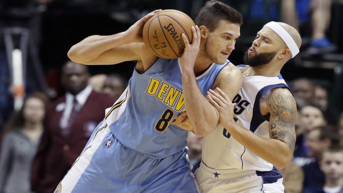 Point guard Deron Williams, right, guarding Nuggets forward Danilo Gallinari, and the Mavericks played stick defense in the third quarter while holiding Denver to five points.