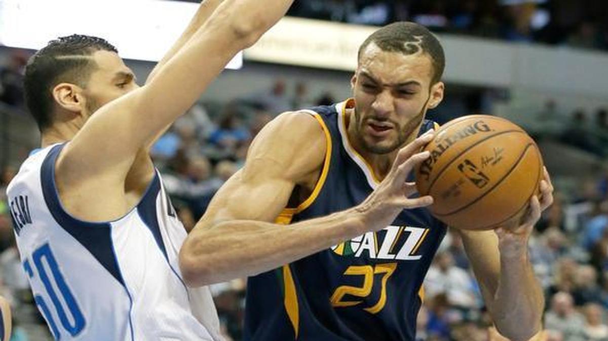 Utah Jazz center Rudy Gobert (27) drives against Dallas Mavericks center Salah Mejri (50) during the second half of an NBA basketball game in Dallas, Friday, Jan. 20, 2017. The Jazz won 112-107 in overtime.