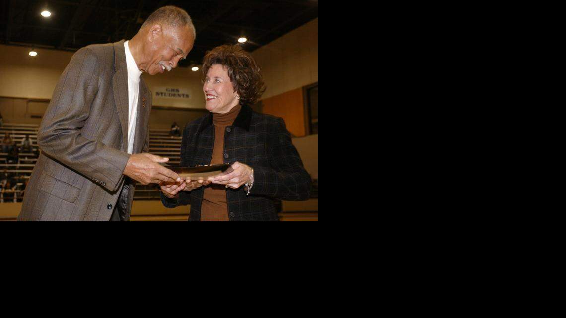 
Retired Fort Worth Dunbar coach Robert Hughes (the boys all-time winningest coach) presents Granbury girls coach Leta Andrews, the new all-time winningest girls basketball coach in the country, with a platter honoring her achievement at Granbury High School gym at Dec. 10, 2005.
