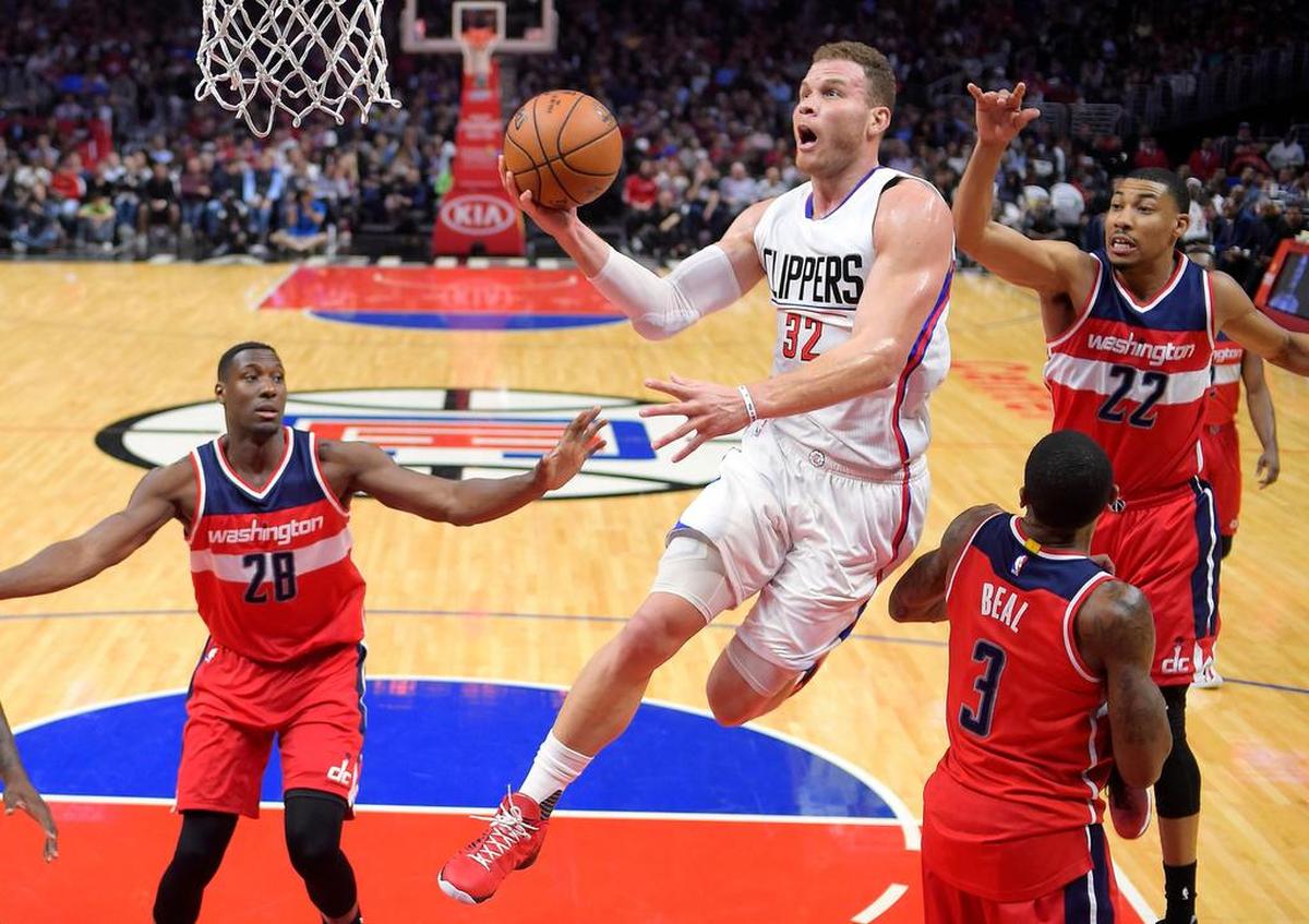 In this March 29, 2017, file photo, Los Angeles Clippers forward Blake Griffin, second from left, drives against the Washington Wizards. A person with knowledge of the situation says Griffin has agreed Friday, June 30, to a five-year deal worth approximately $175 million to remain with the Clippers.