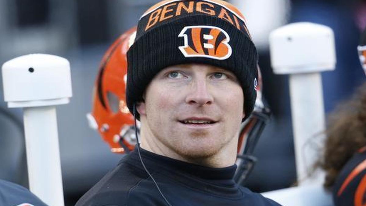 Cincinnati Bengals quarterback Andy Dalton sits on the sidelines in the second half against the Baltimore Ravens, Sunday, Jan. 3, 2016, in Cincinnati. Cincinnati won 24-16.