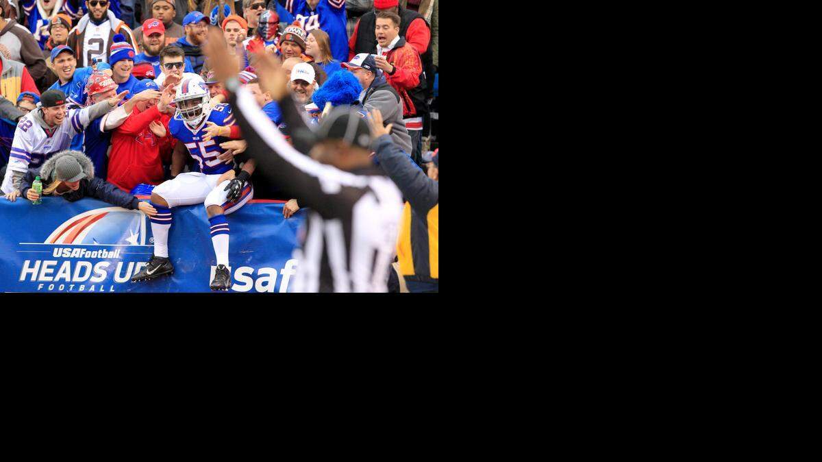 
Bills defensive end Jerry Hughes celebrates with fans after returning a fumble for a touchdown against the Browns.


