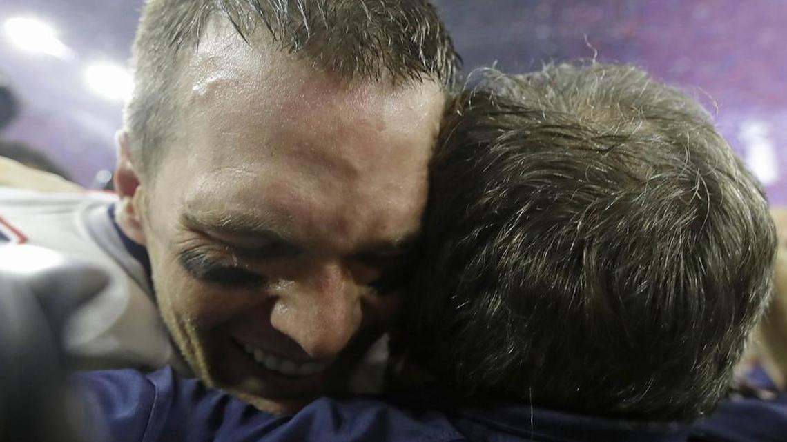 New England Patriots' Tom Brady celebrates with head coach Bill Belichick after winning Super Bowl 51in overtime Sunday. The Patriots won 34-28.