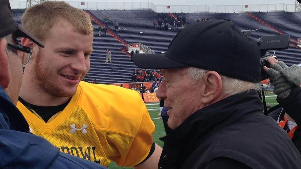 Dallas Cowboys owner Jerry Jones meets North Dakota State quarterback Carson Wentz on Wednesday at a Senior Bowl practice.