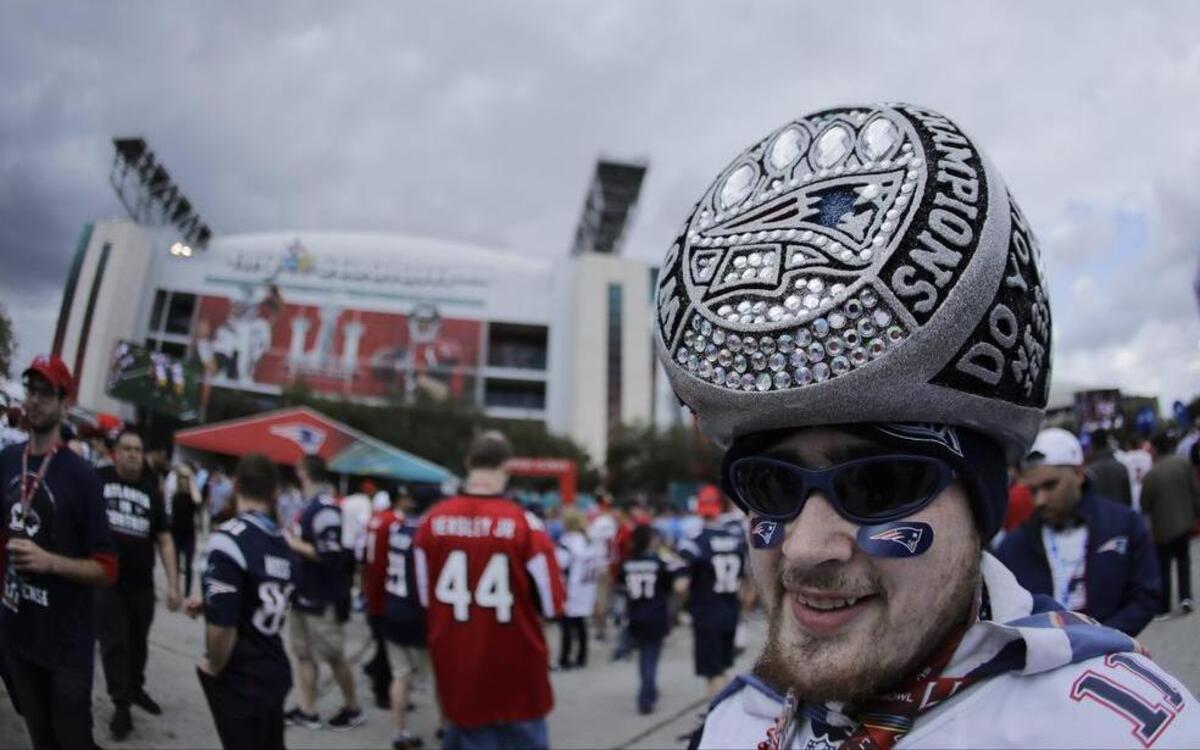 A Patriots fanatic poses for a photo before Super Bowl 51 Sunday outside NRG Stadium in Houston.