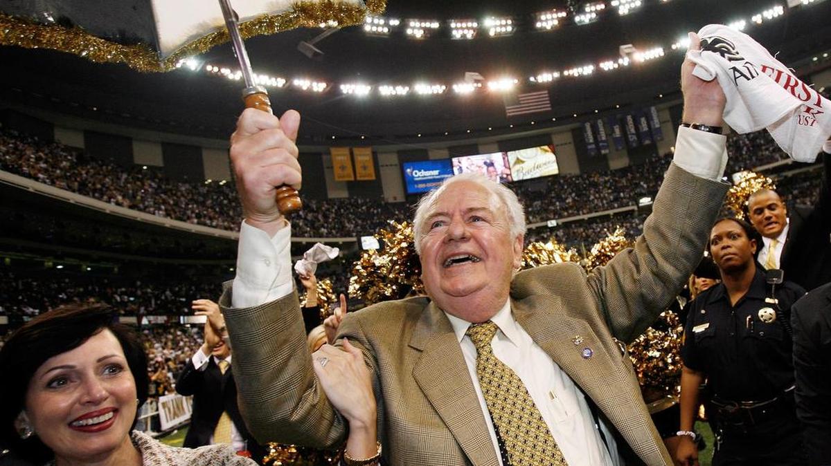 In this Sept. 25, 2006 file photo, New Orleans Saints owner Tom Benson dances with his wife Gayle Marie Benson after their game against the Atlanta Falcons at the newly reopened Louisiana Superdome in New Orleans. The Saints won 23-3. The Superdome went from a candidate for demolition to a symbol of rebirth in the 13 months following Hurricane Katrina.
