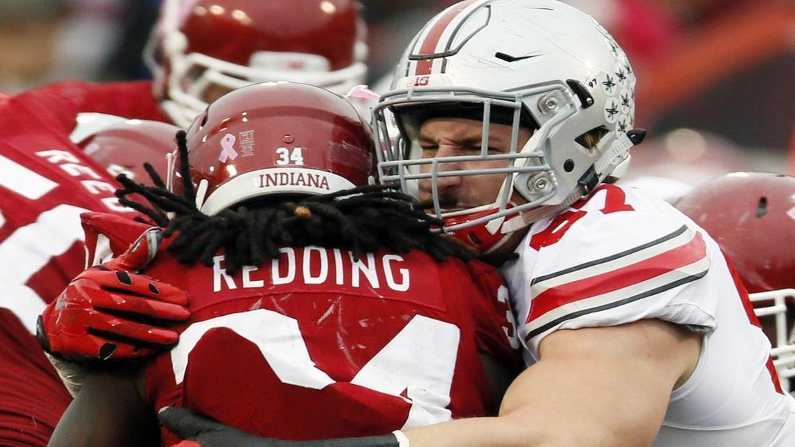 Ohio State defensive lineman Joey Bosa (97) stops Indiana running back Devine Redding (34) . Bosa is the Cowboys’ target at No. 4 in our Mock Draft 3.0.