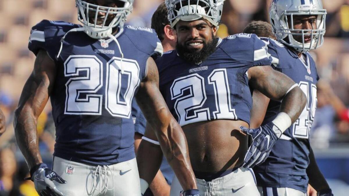 Dallas Cowboys running back Darren McFadden (20) and running back Ezekiel Elliott (21) joke in warmups before the game as the Dallas Cowboys play the Los Angeles Rams. McFadden is expected to start in place of Elliott, who is suspended for the first six games of the season.