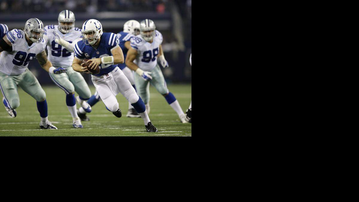 
Colts quarterback Andrew Luck, surrounded by Cowboys defenders, turned in one of his poorest performances of the season while completing 15 of 22 passes for 109 yards and two interceptions.


