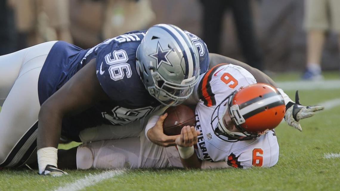 Cowboys defensive tackle Maliek Collins wrestles Browns quarterback Cody Kessler to the ground for one of his two sacks Sunday.