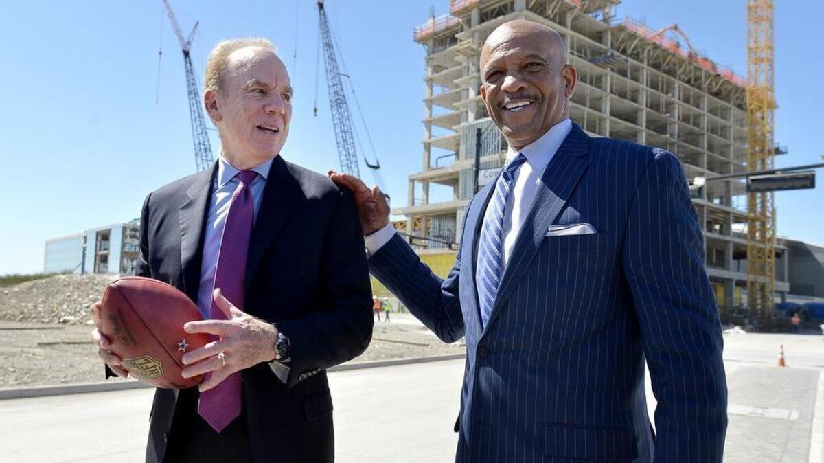 Dallas Cowboys legends Roger Staubach and Drew Pearson talk to the media after playing catch at The Star in Frisco in Frisco in May 2016.