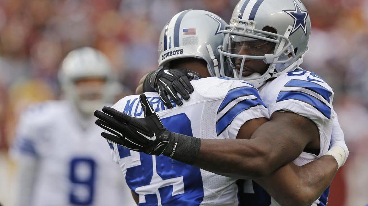 DeMarco Murray (29) gets a hug from wide receiver Dez Bryant (88) during happier times with the Dallas Cowboy in 2014. Murray had a bad year in Philadelphia last year and Bryant wants him to come back home to Dallas.